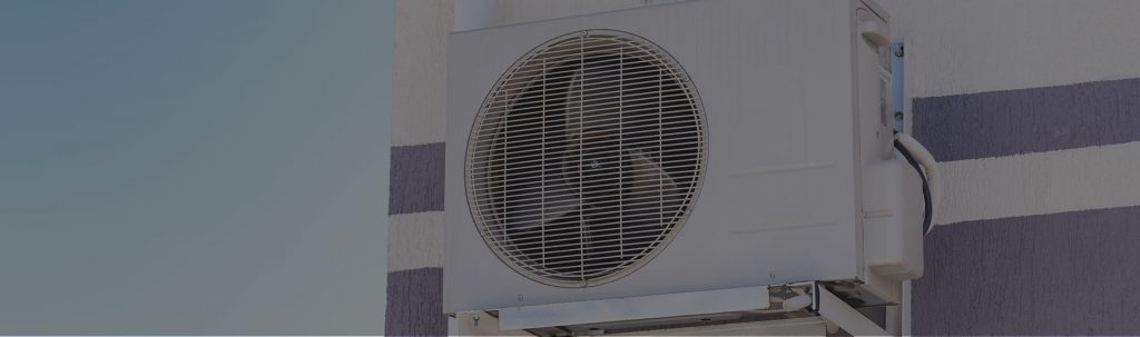 air conditioner on the exterior wall of the house